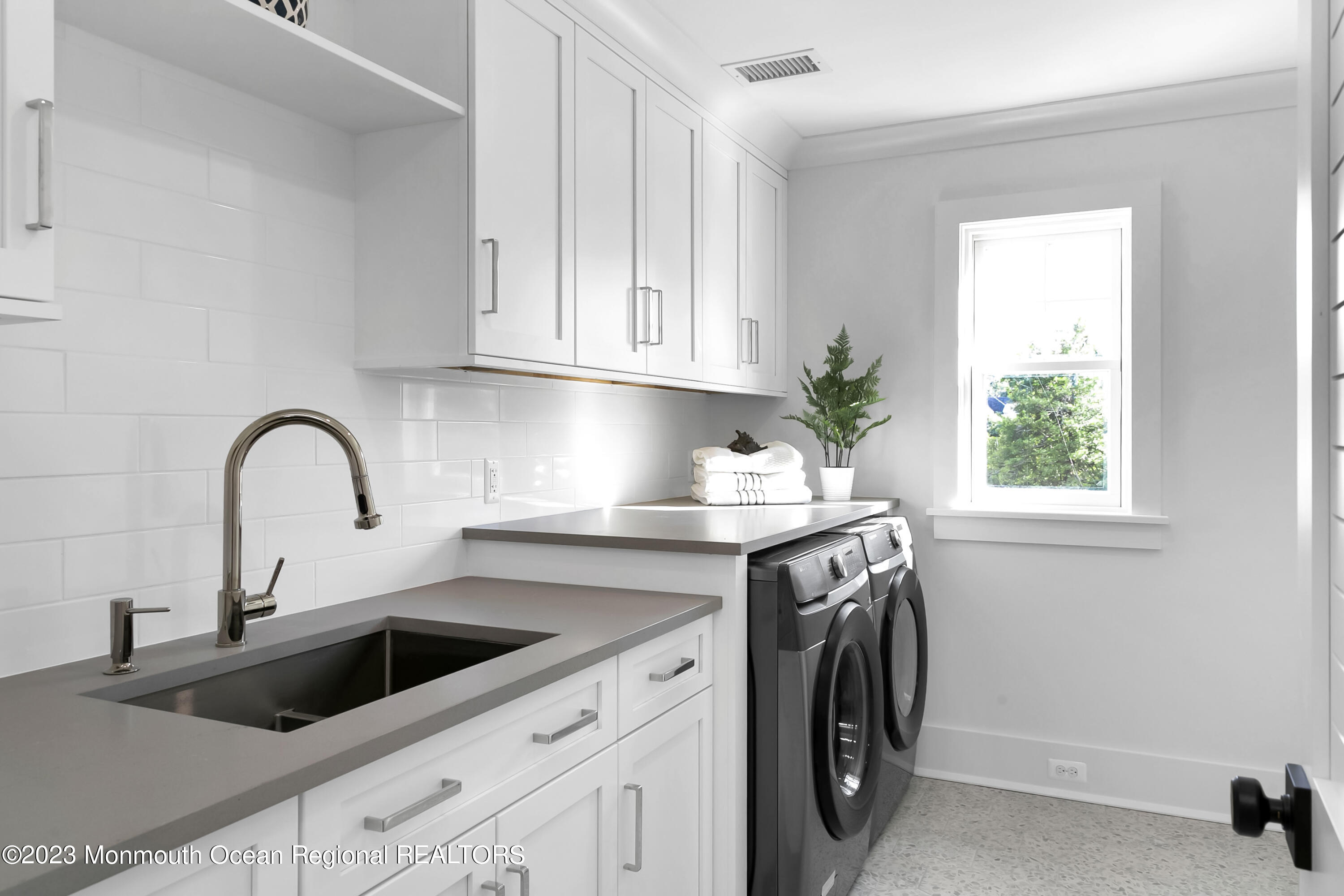 65 South Boulevard Spring Lake, NJ 07762 - Photo 57 of 80 a view with a sink a washer and dryer