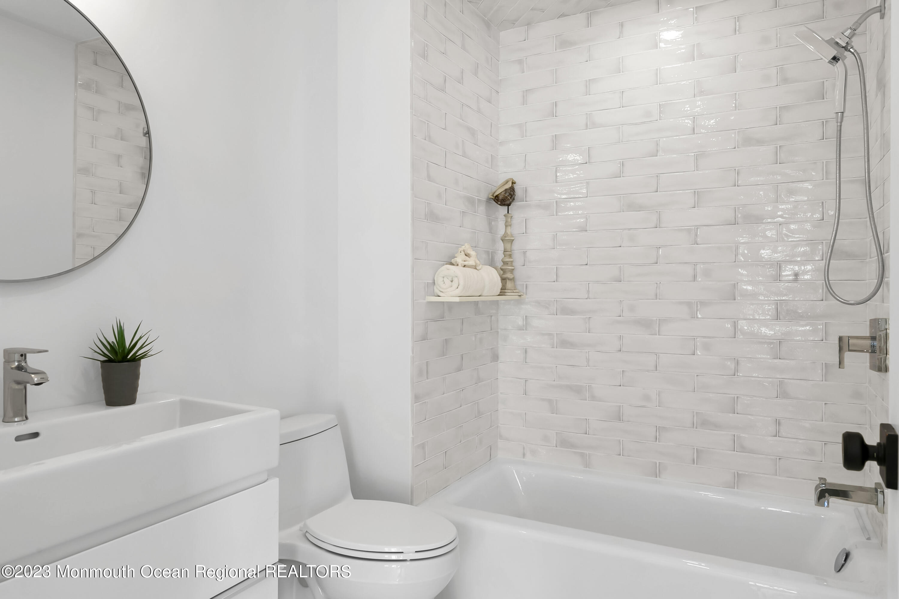 65 South Boulevard Spring Lake, NJ 07762 - Photo 58 of 80 a bath room with a toilet a sink and a bath tub