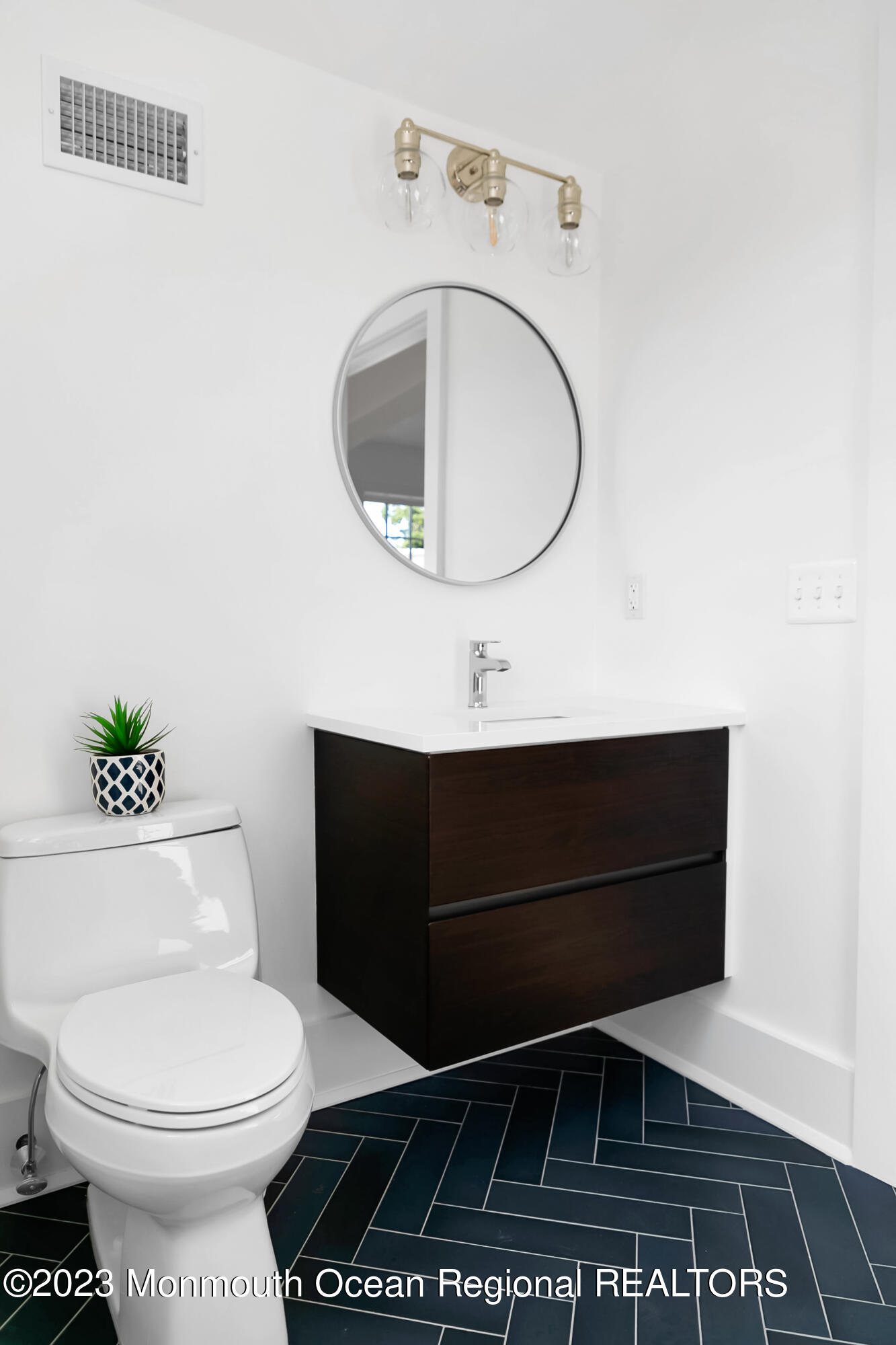 65 South Boulevard Spring Lake, NJ 07762 - Photo 60 of 80 a bathroom with a toilet and a sink