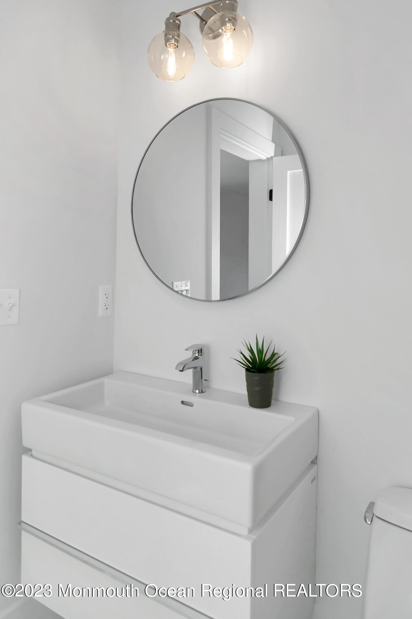 65 South Boulevard Spring Lake, NJ 07762 - Photo 61 of 80 a bathroom with a sink and mirror