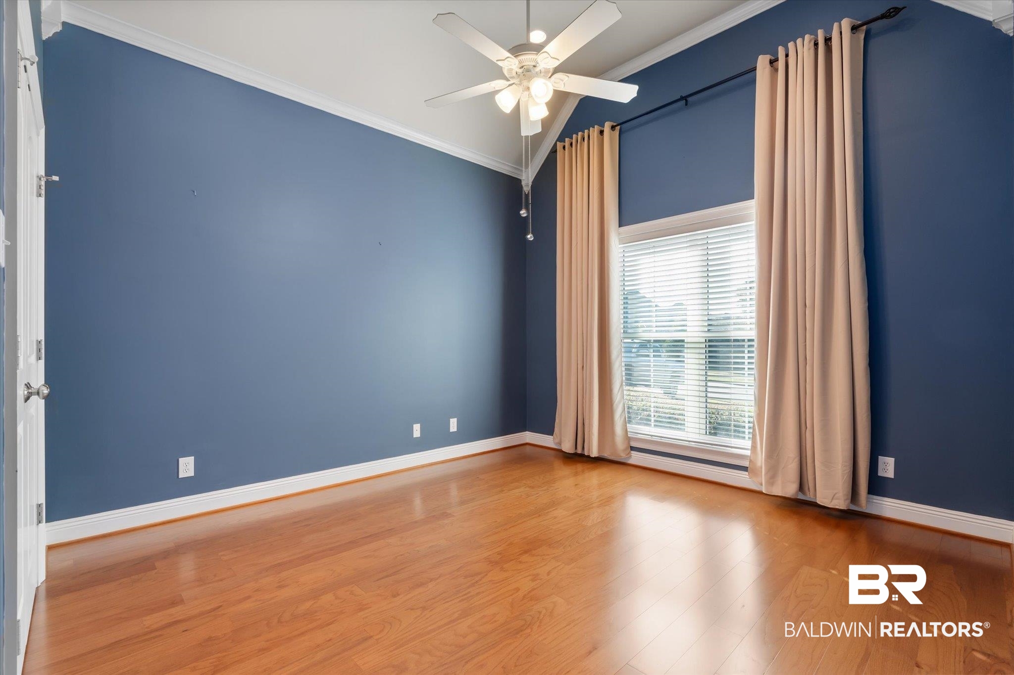 10730 Flagstone Drive Mobile, AL 36608 - Photo 13 of 20 Unfurnished room with crown molding, hardwood / wood-style flooring, and ceiling fan