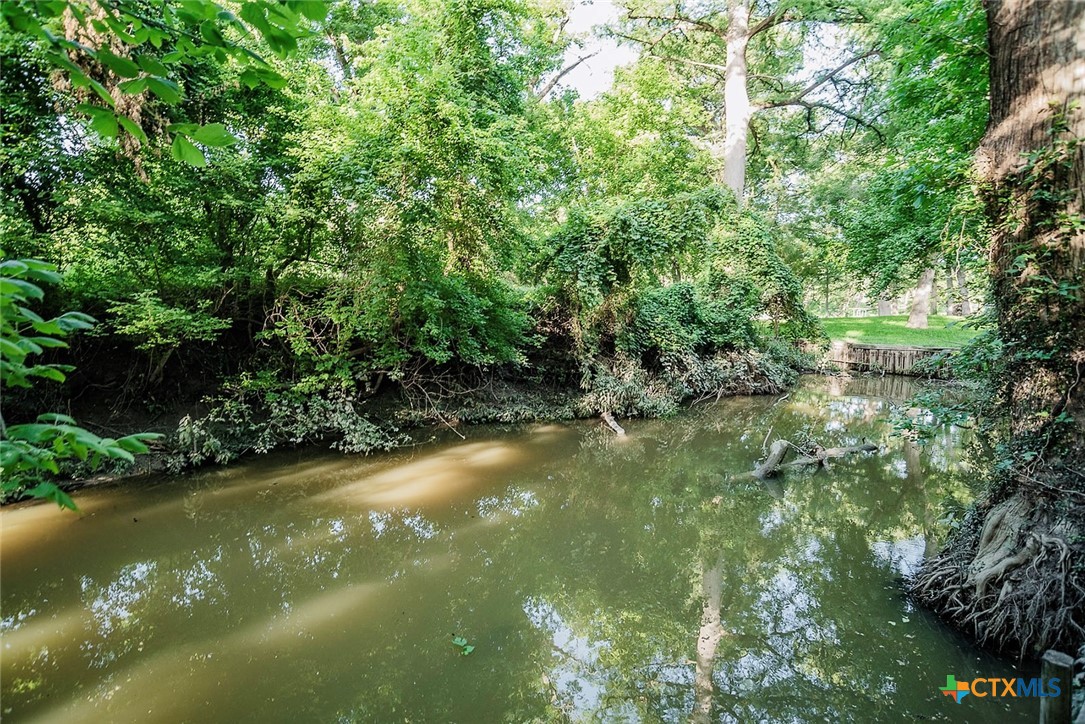 140 Riverview Road McQueeney, TX 78123 - Photo 1 of 1 a view of a lake from a yard