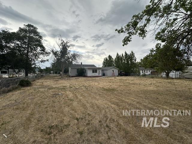 1301 Ridge Street Pocatello, ID 83201 - Photo 7 of 12 Expansive lot featuring a single-story residence with a white exterior