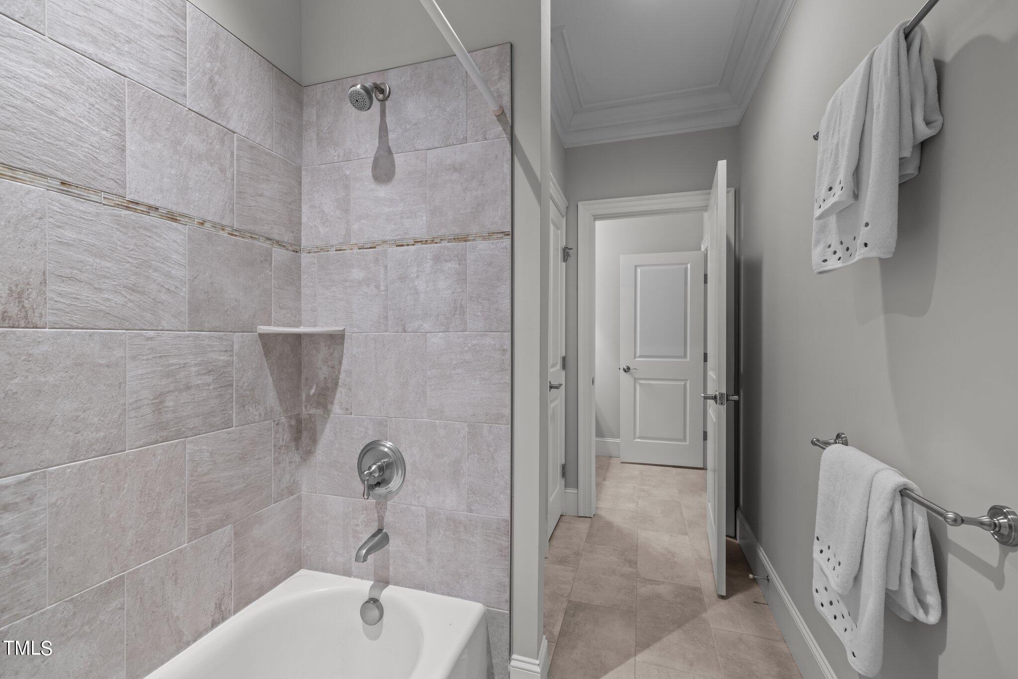 504 Valleyshire Road Durham, NC 27707 - Photo 26 of 38 a bathroom with a tub shower sink and vanity