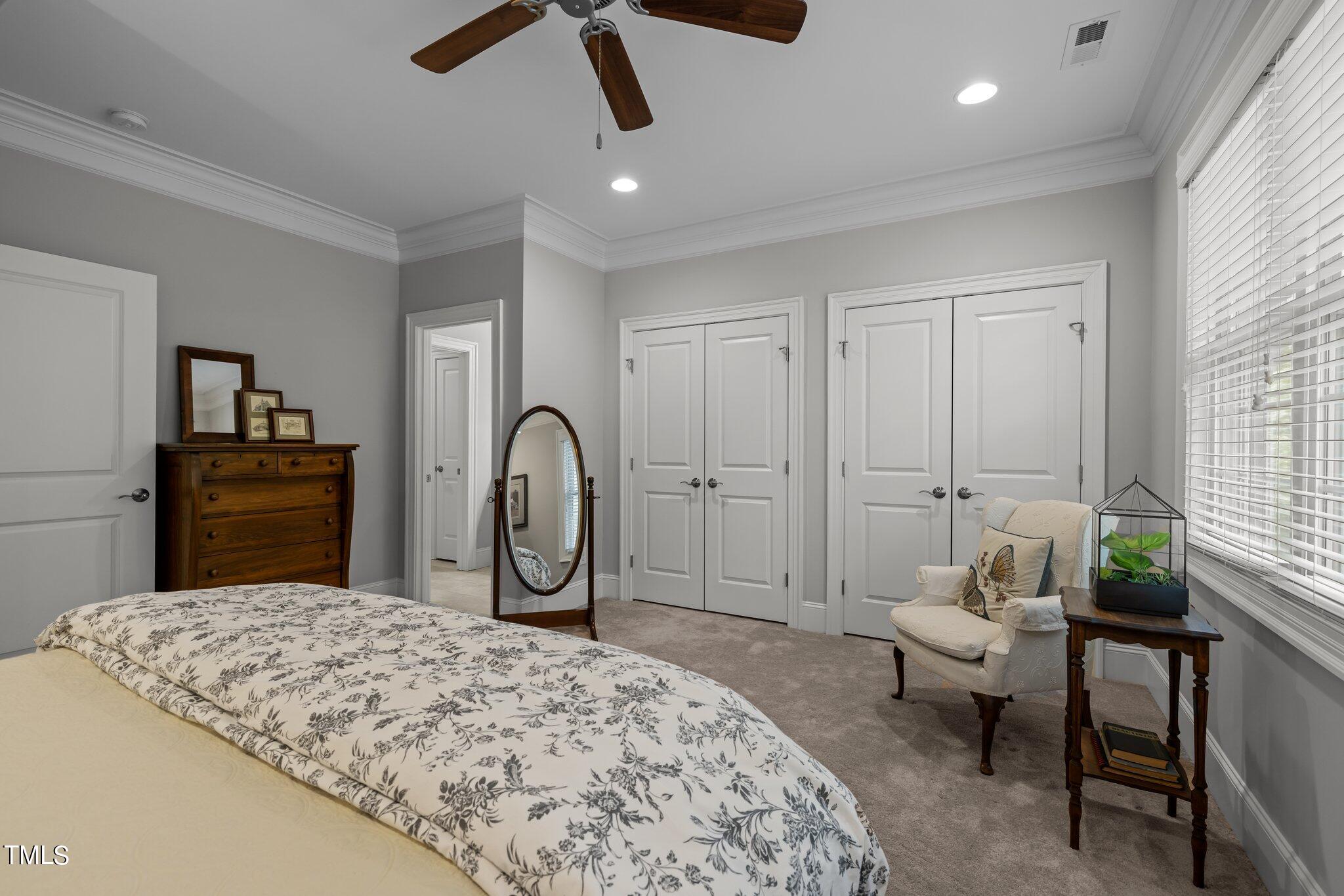 504 Valleyshire Road Durham, NC 27707 - Photo 29 of 38 a spacious bedroom with a bed and furniture