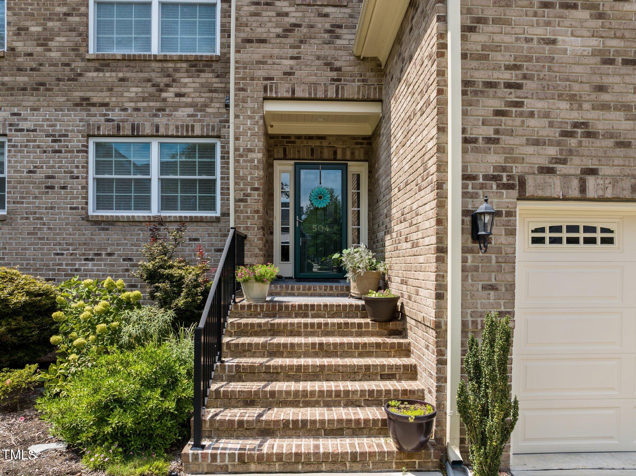 504 Valleyshire Road Durham, NC 27707 - Photo 37 of 38 a front view of a house with a garden