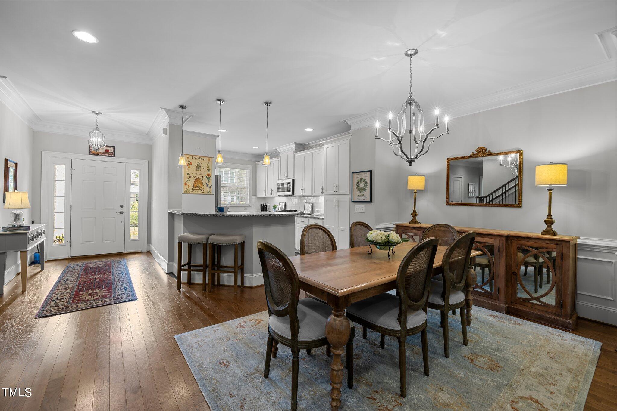 504 Valleyshire Road Durham, NC 27707 - Photo 9 of 38 a view of a dining room with furniture and wooden floor