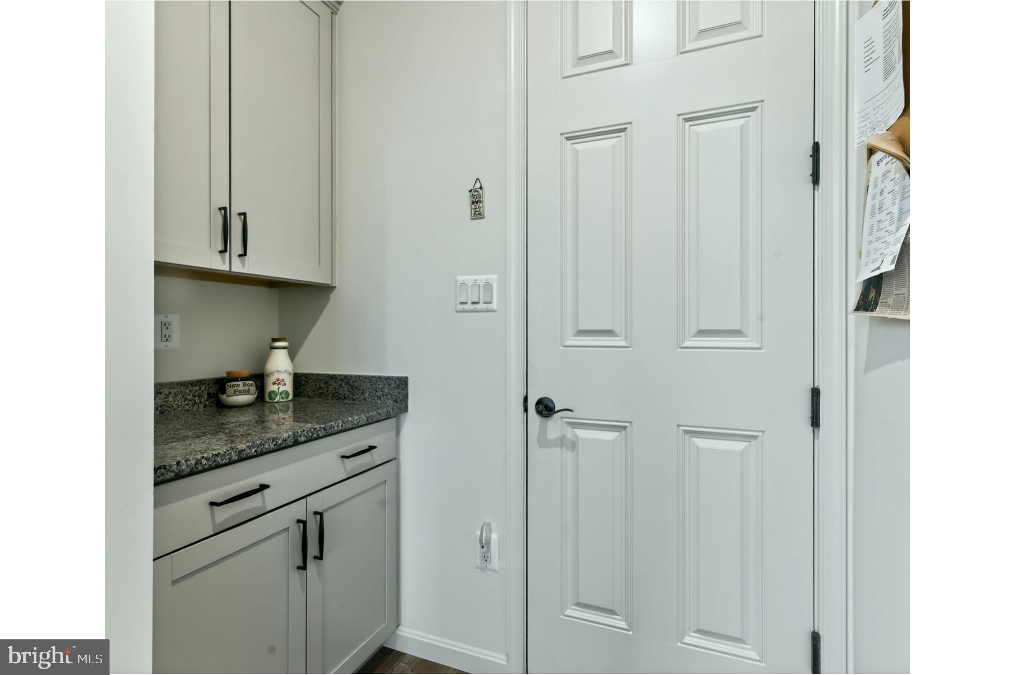 401 Karn Place Brunswick, MD 21716 - Photo 12 of 82 a bathroom with a granite countertop sink and vanity