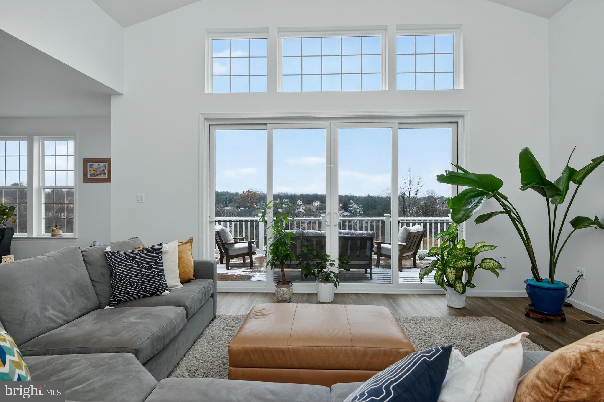 401 Karn Place Brunswick, MD 21716 - Photo 16 of 82 a living room with furniture potted plant and a large window