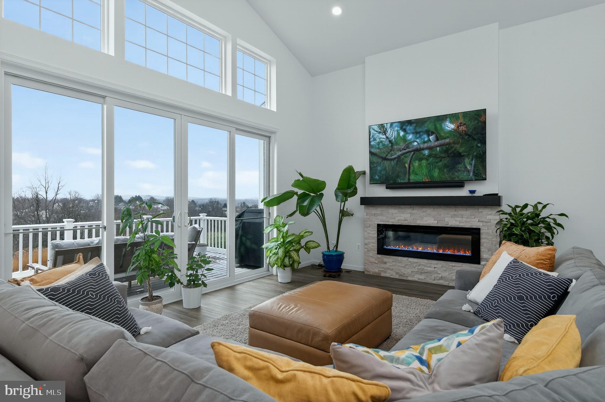401 Karn Place Brunswick, MD 21716 - Photo 17 of 82 a living room with furniture a large window and a fireplace