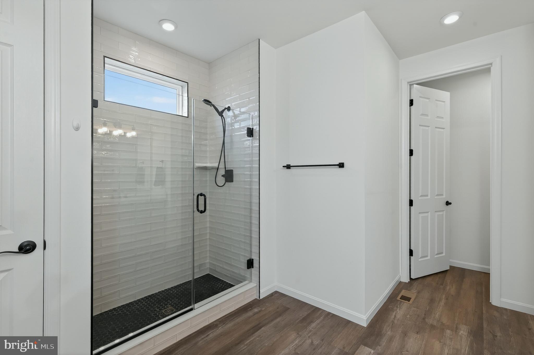 401 Karn Place Brunswick, MD 21716 - Photo 26 of 82 a bathroom with a shower and a sink