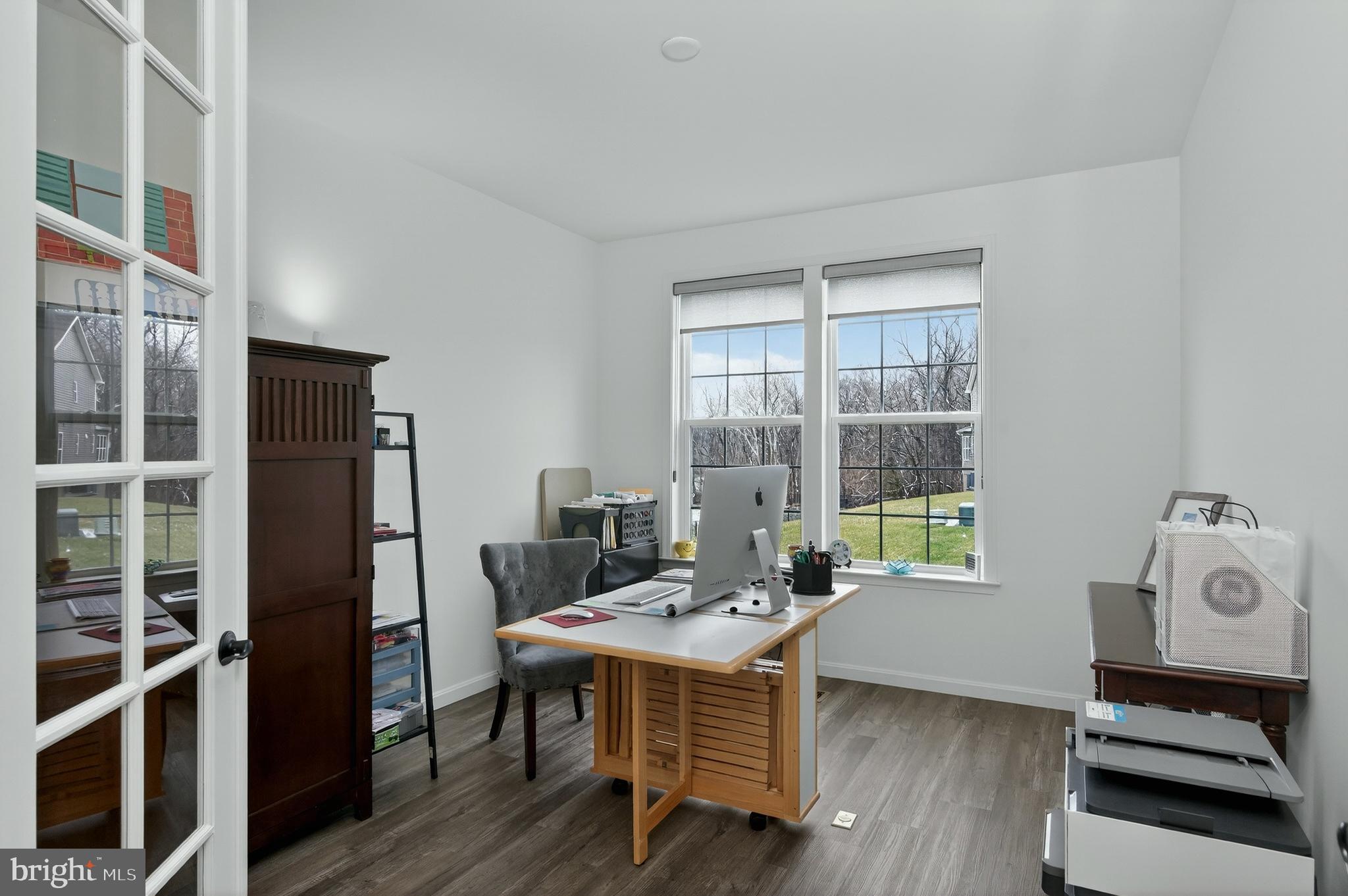 401 Karn Place Brunswick, MD 21716 - Photo 32 of 82 a view of a dining room with furniture window and wooden floor