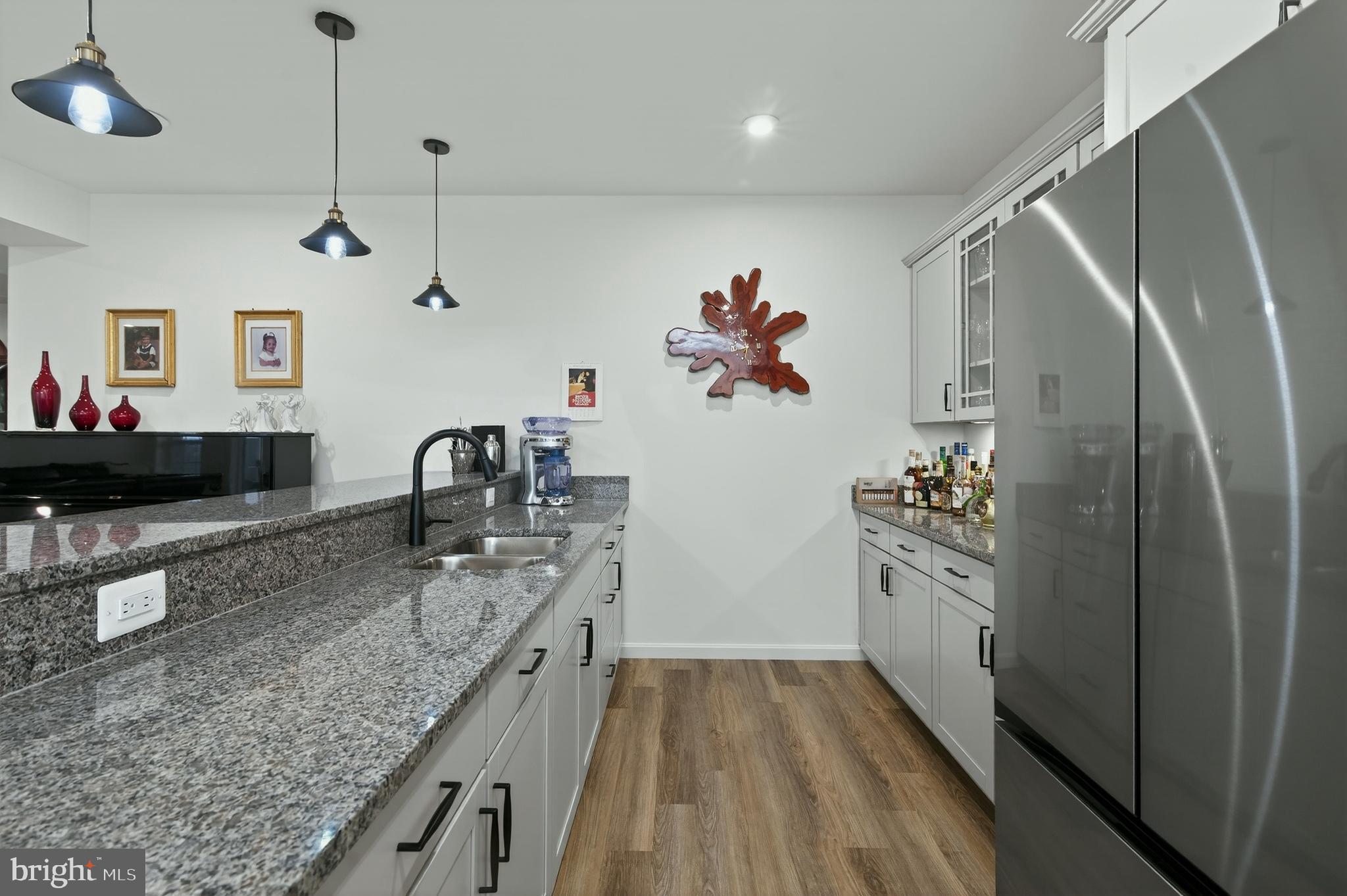 401 Karn Place Brunswick, MD 21716 - Photo 48 of 82 a kitchen with stainless steel appliances granite countertop a refrigerator and a stove top oven