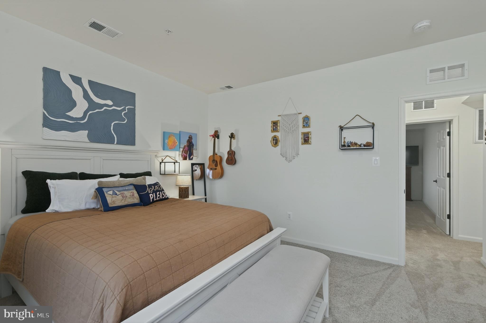 401 Karn Place Brunswick, MD 21716 - Photo 55 of 82 a bedroom with a bed and painting on the wall