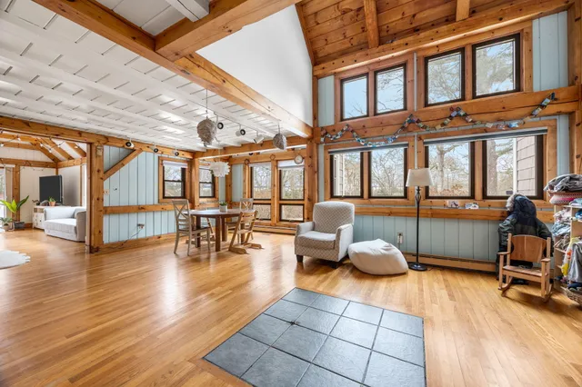 a lobby with furniture and floor to ceiling windows