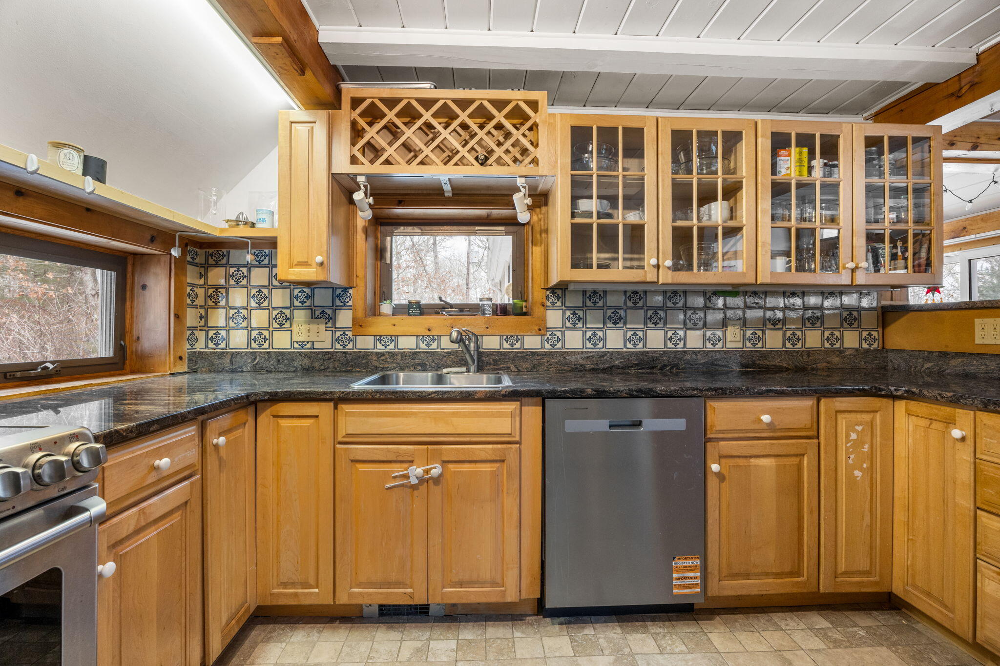 248 Great Neck Road Wareham, MA 02571 - Photo 23 of 54 a kitchen with stainless steel appliances granite countertop a stove and a sink