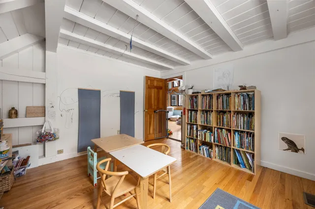 a room with furniture and a book shelf