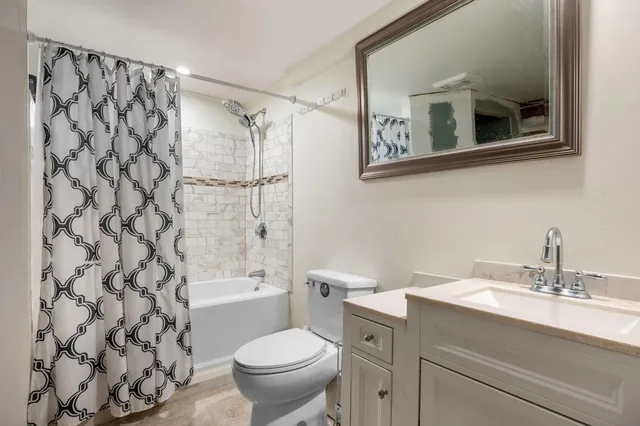 a front view of a house with a yard covered in snow
