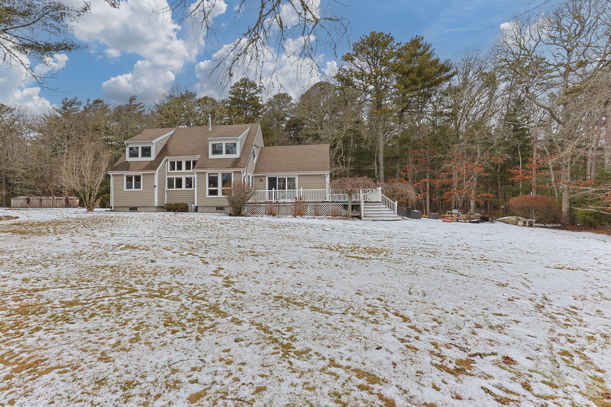 248 Great Neck Road Wareham, MA 02571 - Photo 49 of 54 a front view of a house with a yard covered with snow