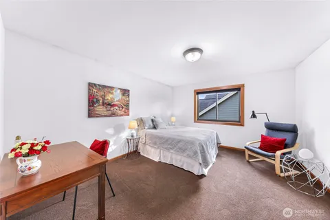 a bedroom with furniture and a couch