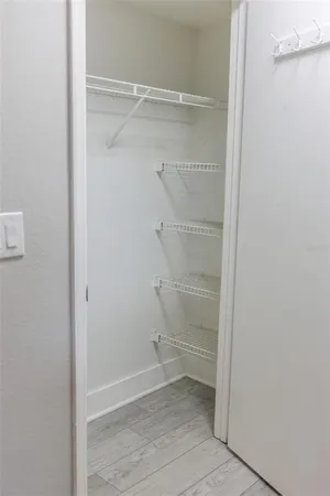 a view of an empty walk in closet