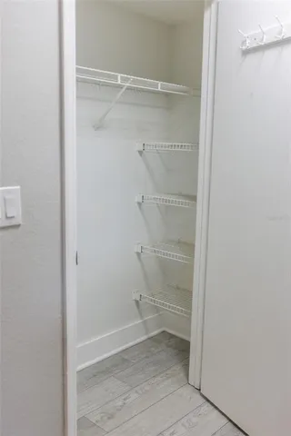 a view of an empty walk in closet