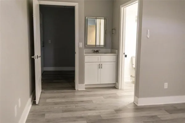 a view of a bathroom with a sink and a mirror