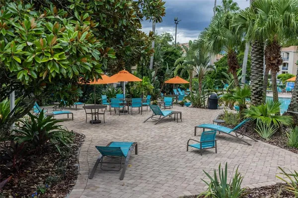 an outdoor space with patio furniture and potted plants
