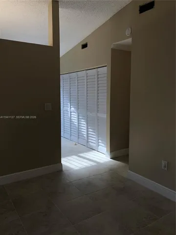 a view of empty room with windows