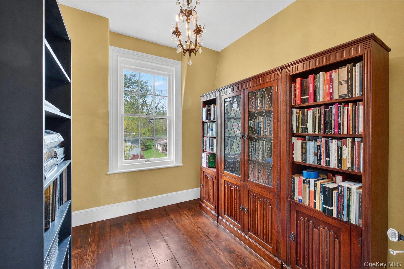 121 Old Glenham Road Fishkill, NY 12524 - Photo 30 of 50 Room featuring wide-plank wood flooring, white trim, and a large window.