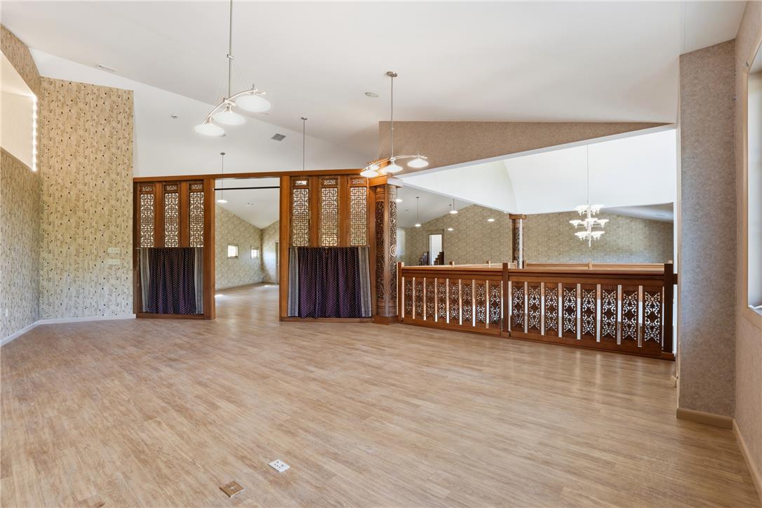 6271 Batman Road Zionsville, PA 18092 - Photo 67 of 100 Ornate wood details and a vaulted ceiling elevate this versatile living space.