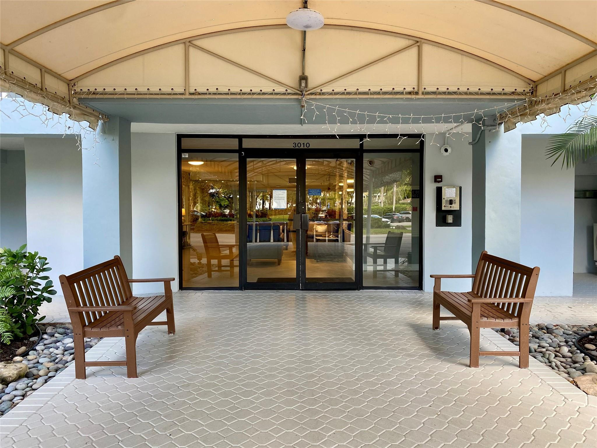 3010 North Course Drive, Unit 209 Pompano Beach, FL 33069 - Photo 24 of 39 Building Lobby Entrance