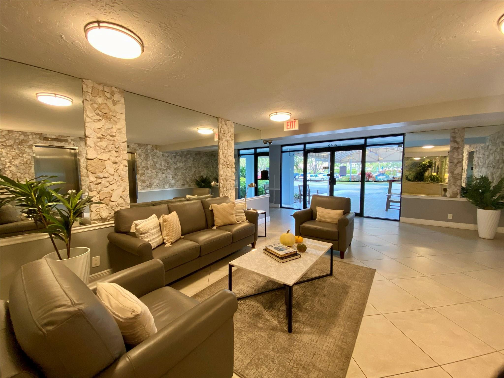 3010 North Course Drive, Unit 209 Pompano Beach, FL 33069 - Photo 25 of 39 Enclosed Secured Lobby