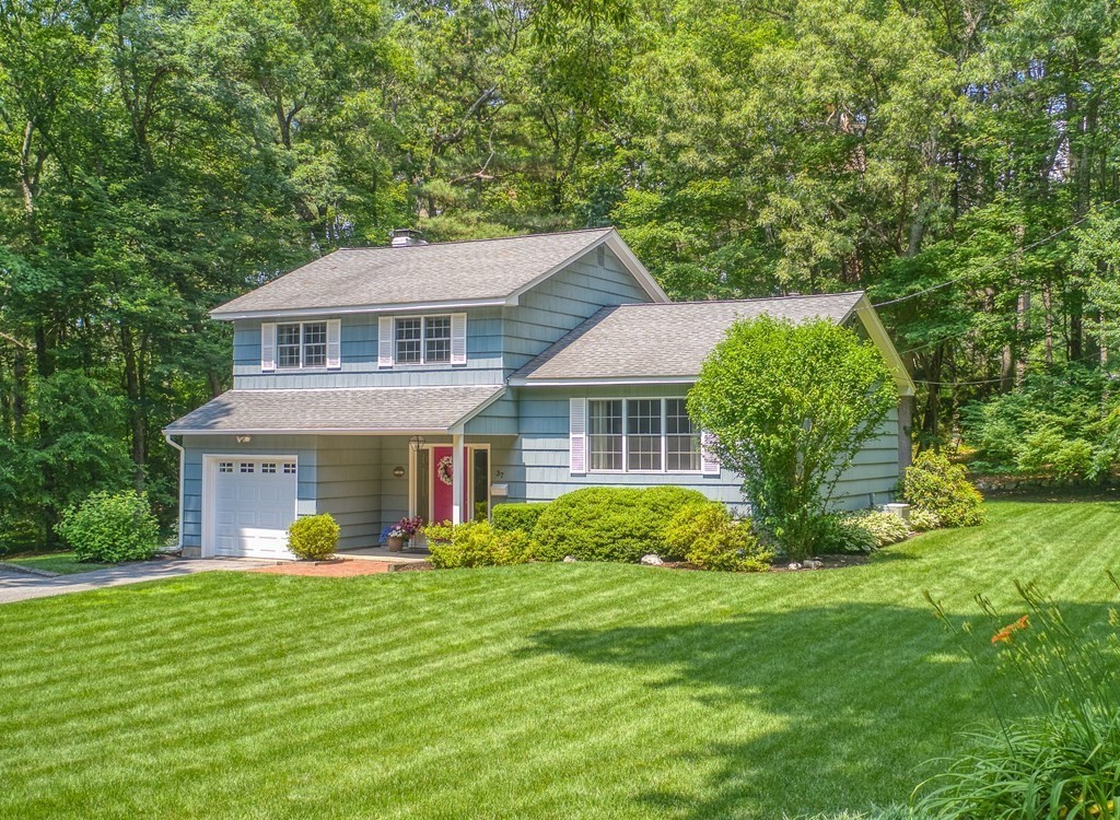 37 Long Meadow Road Chelmsford, MA 01824 - Photo 1 of 30 a front view of a house with a garden