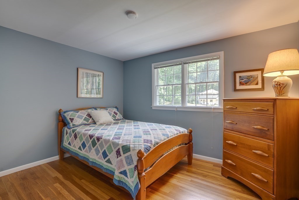 37 Long Meadow Road Chelmsford, MA 01824 - Photo 23 of 30 a bedroom with a bed and a window