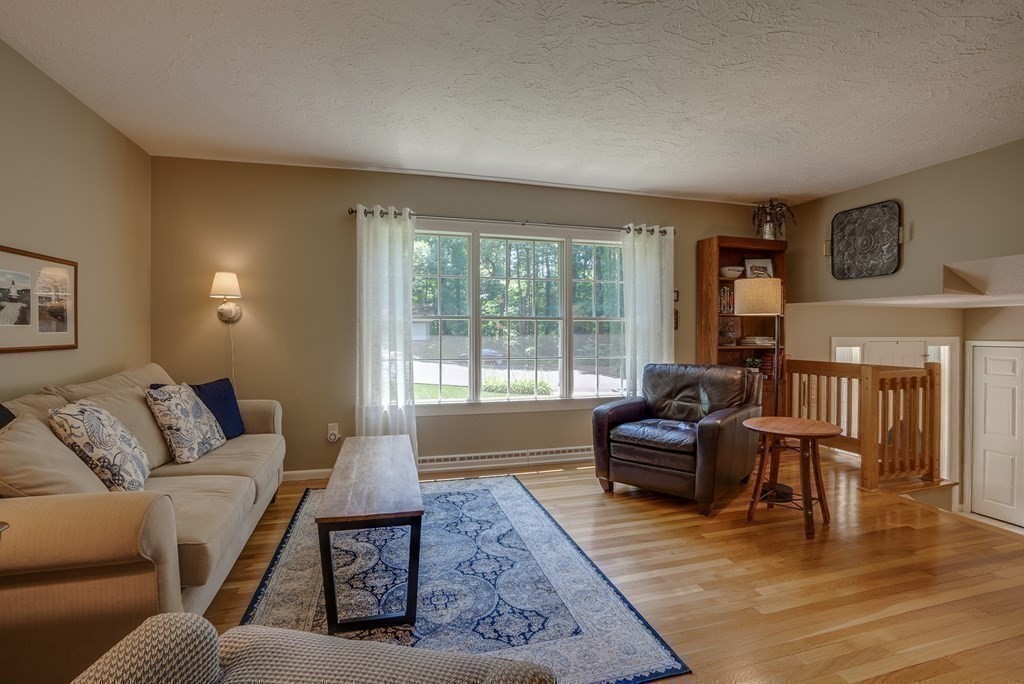 37 Long Meadow Road Chelmsford, MA 01824 - Photo 7 of 30 a living room with furniture and a large window