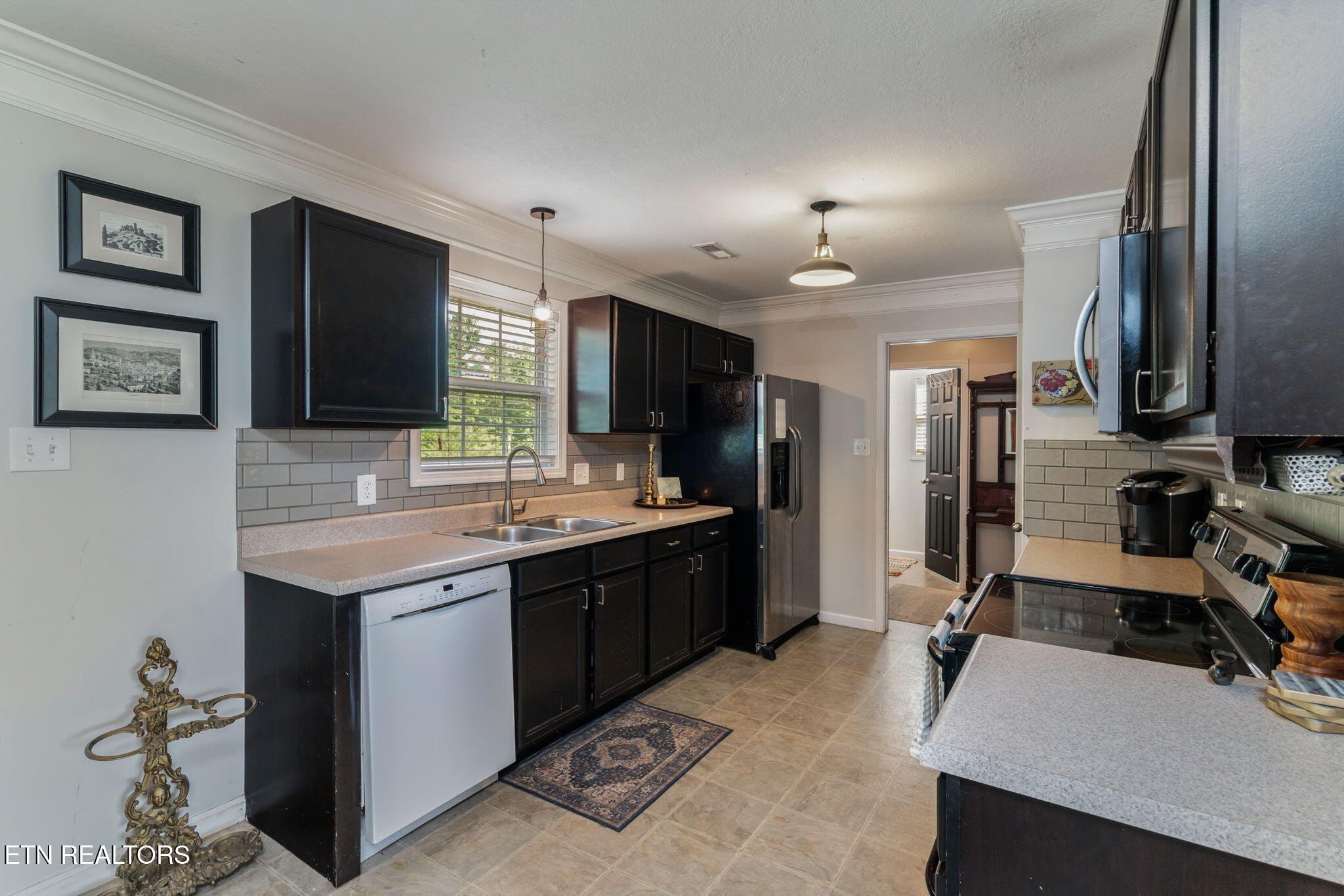 8431 Vessel Lane Powell, TN 37849 - Photo 18 of 46 a kitchen with a sink appliances and cabinets