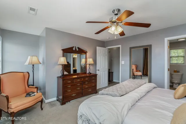 a bedroom with a bed and furniture