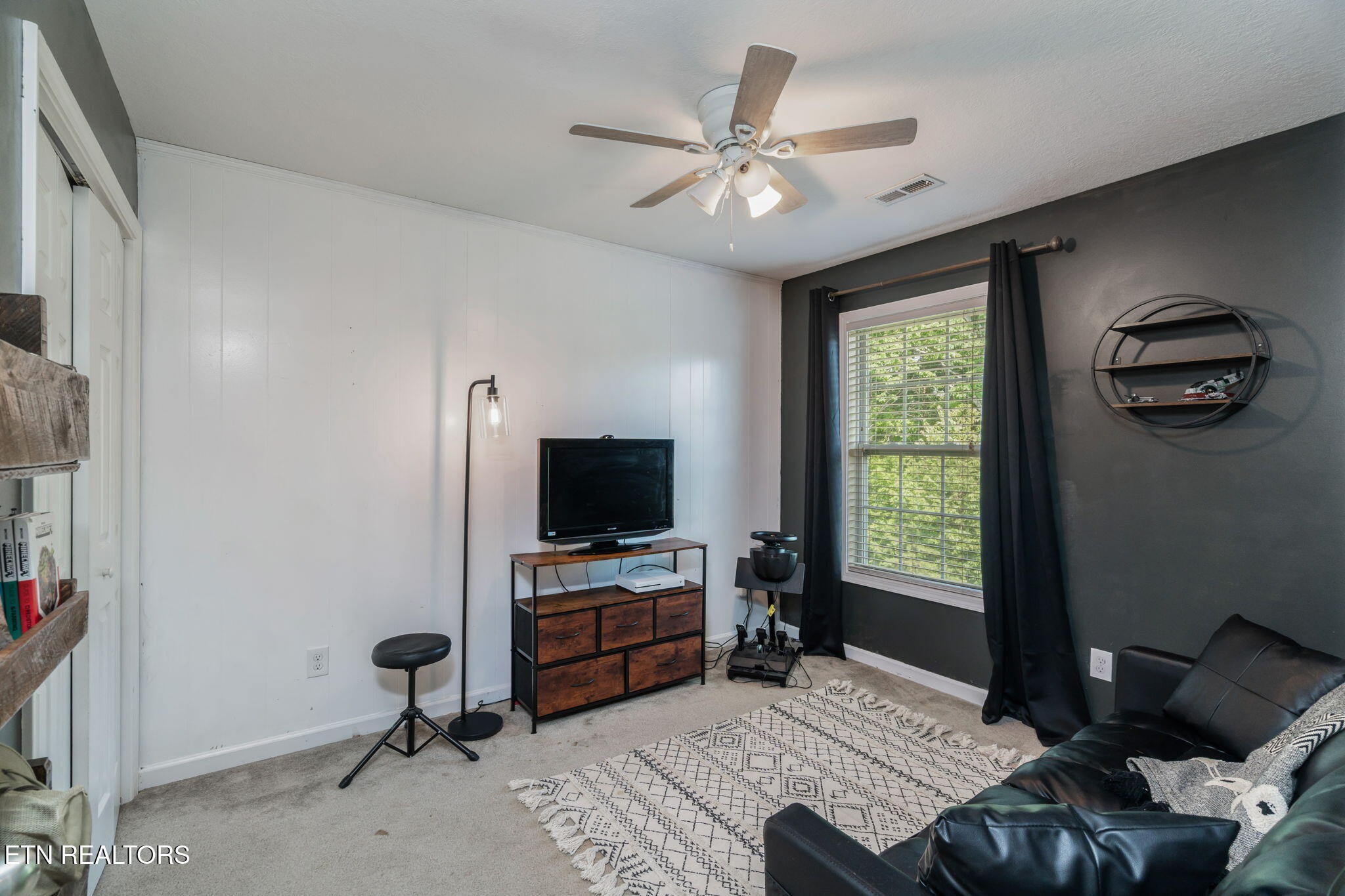 8431 Vessel Lane Powell, TN 37849 - Photo 29 of 46 a living room with furniture and a flat screen tv