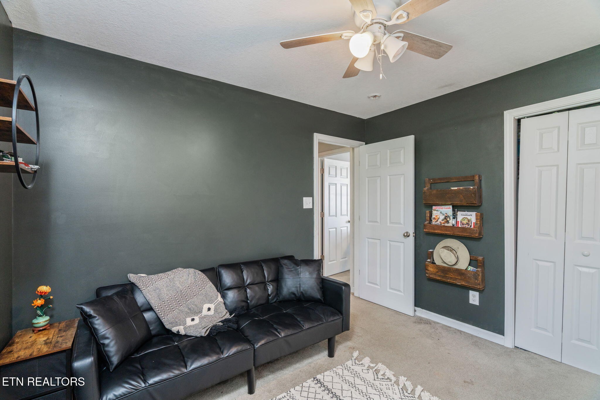 8431 Vessel Lane Powell, TN 37849 - Photo 30 of 46 a living room with furniture and a chandelier