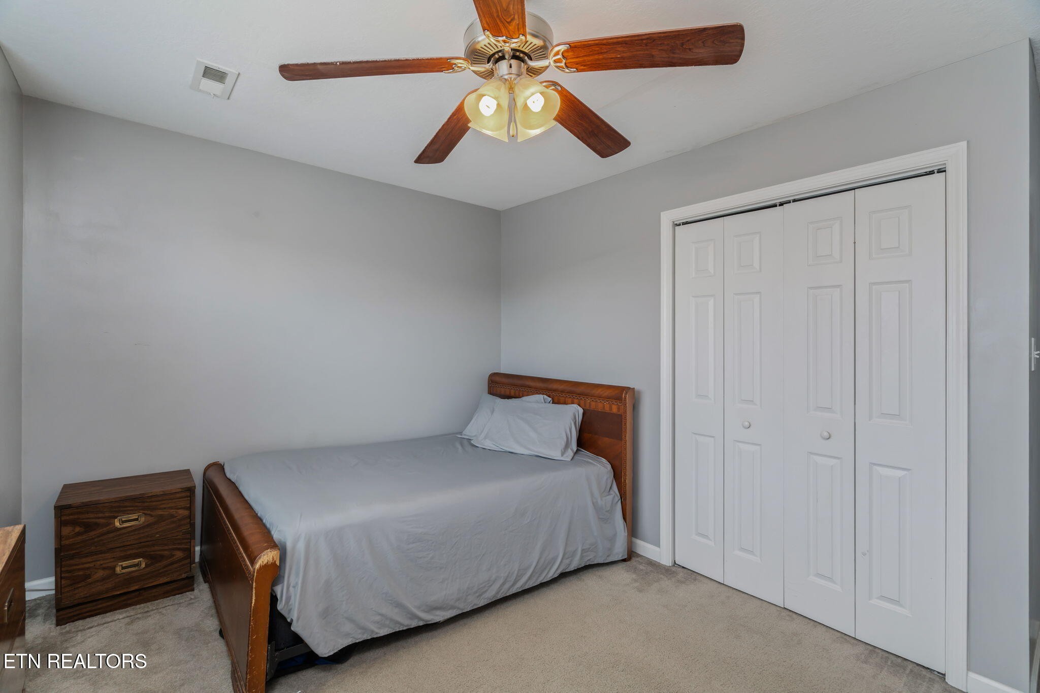 8431 Vessel Lane Powell, TN 37849 - Photo 33 of 46 a bedroom with a bed and a ceiling fan