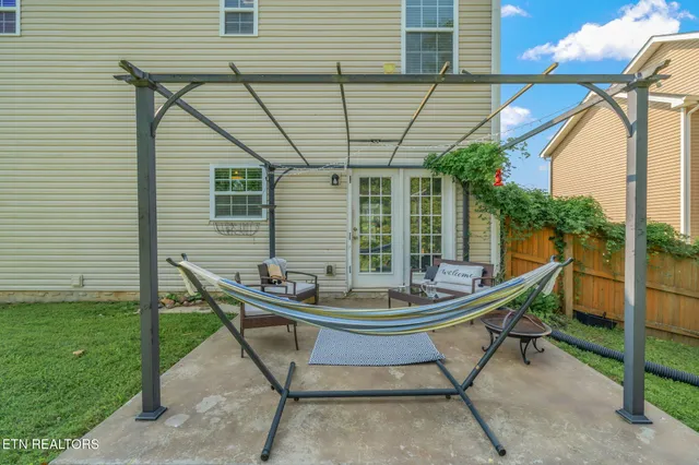 a patio with a table and chairs