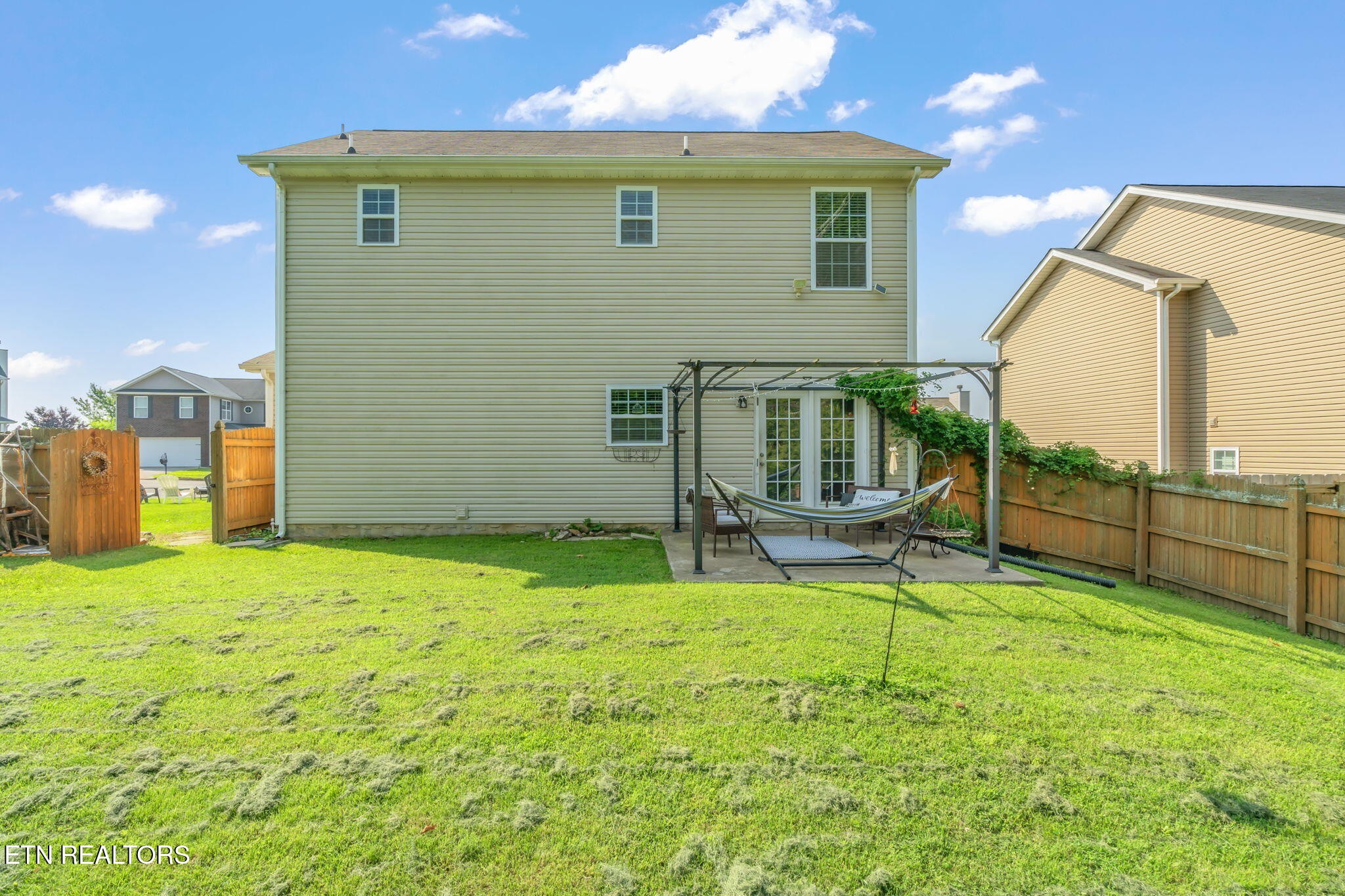 8431 Vessel Lane Powell, TN 37849 - Photo 40 of 46 a backyard of a house with table and chairs