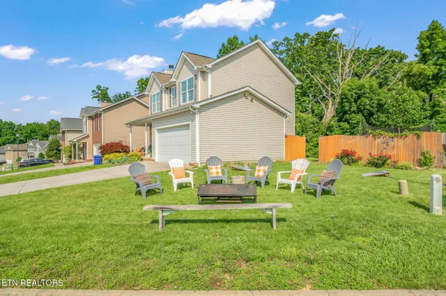a view of a chair and table in the garden