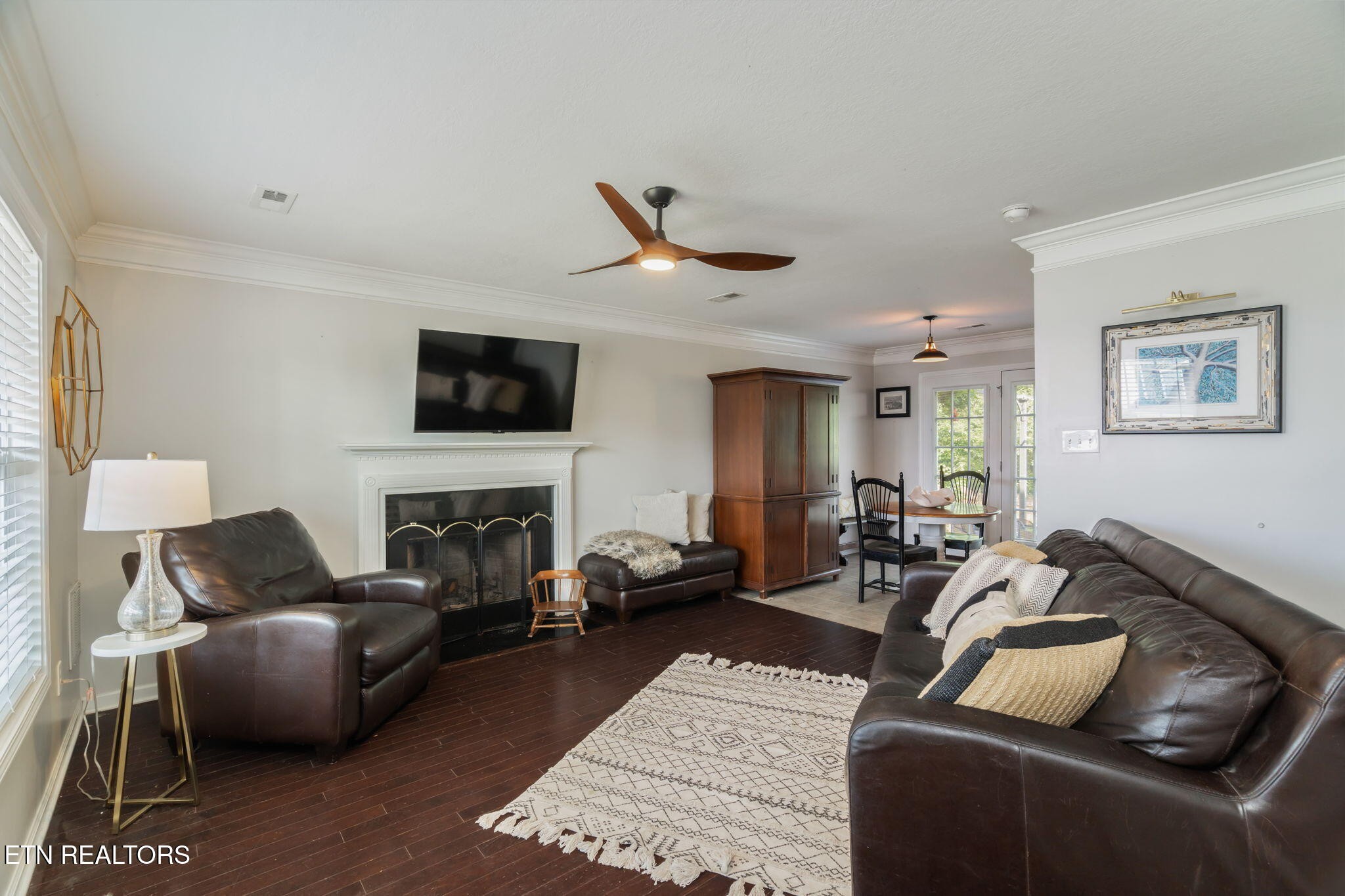 8431 Vessel Lane Powell, TN 37849 - Photo 9 of 46 a living room with furniture a fireplace and a flat screen tv