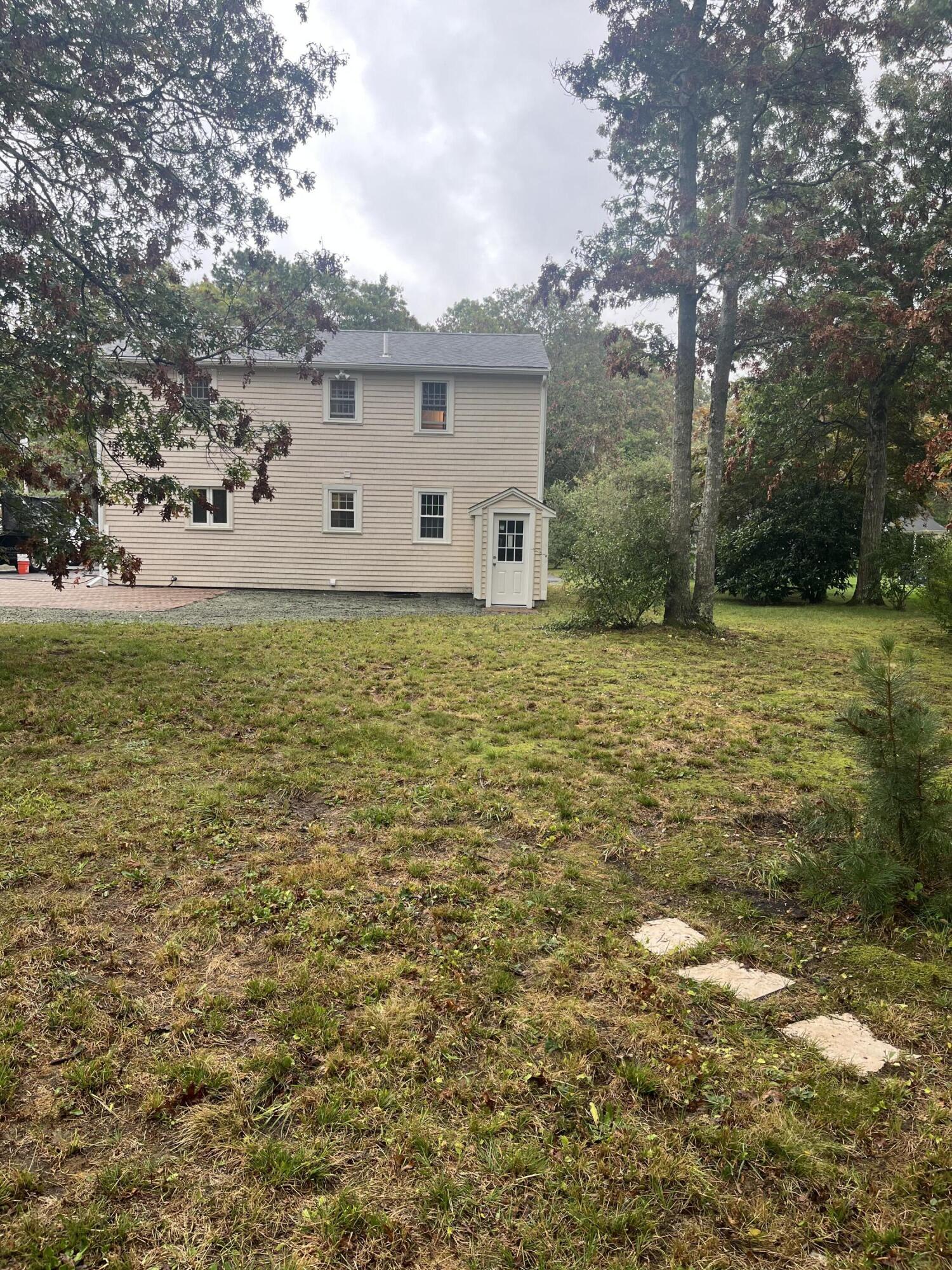 49 Burnham Street Barnstable, MA 02648 - Photo 3 of 17 a view of a large garden with an outdoor space