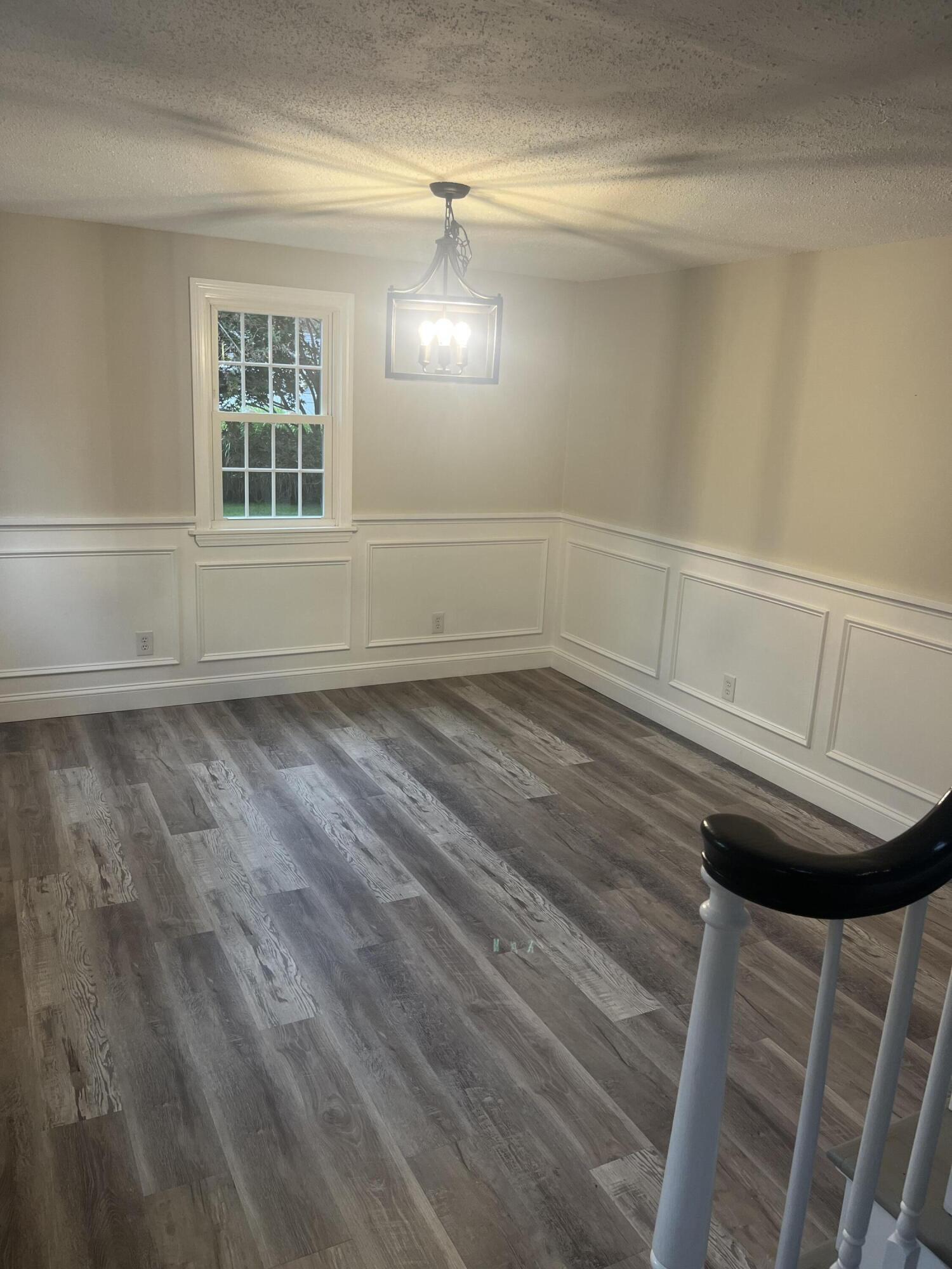 49 Burnham Street Barnstable, MA 02648 - Photo 8 of 17 a view of wooden floor and cabinet in a room