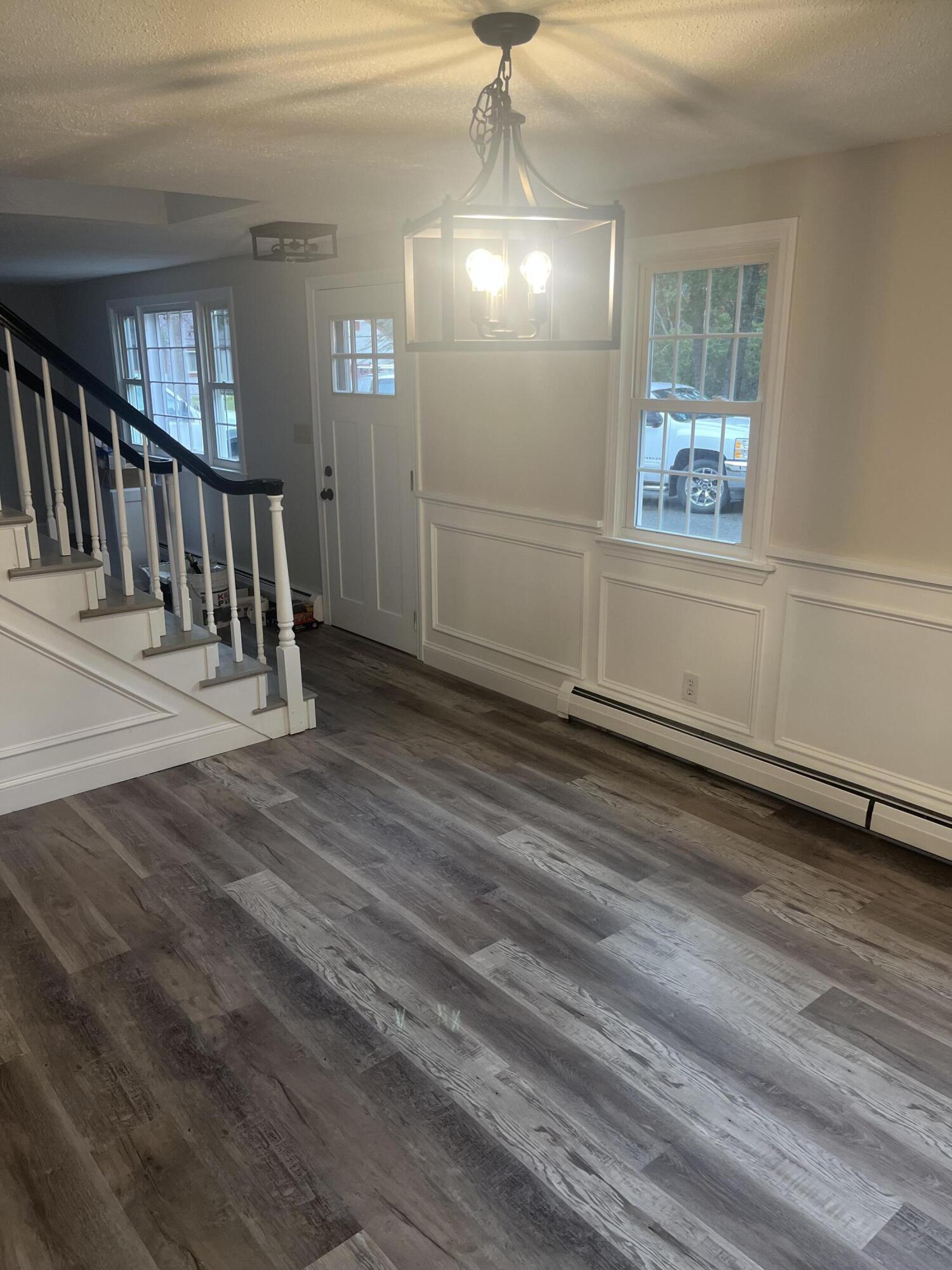 49 Burnham Street Barnstable, MA 02648 - Photo 9 of 17 a view of empty room with wooden floor and fan
