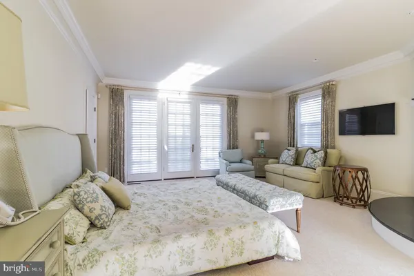 a view of a livingroom with a hardwood floor and a ceiling fan
