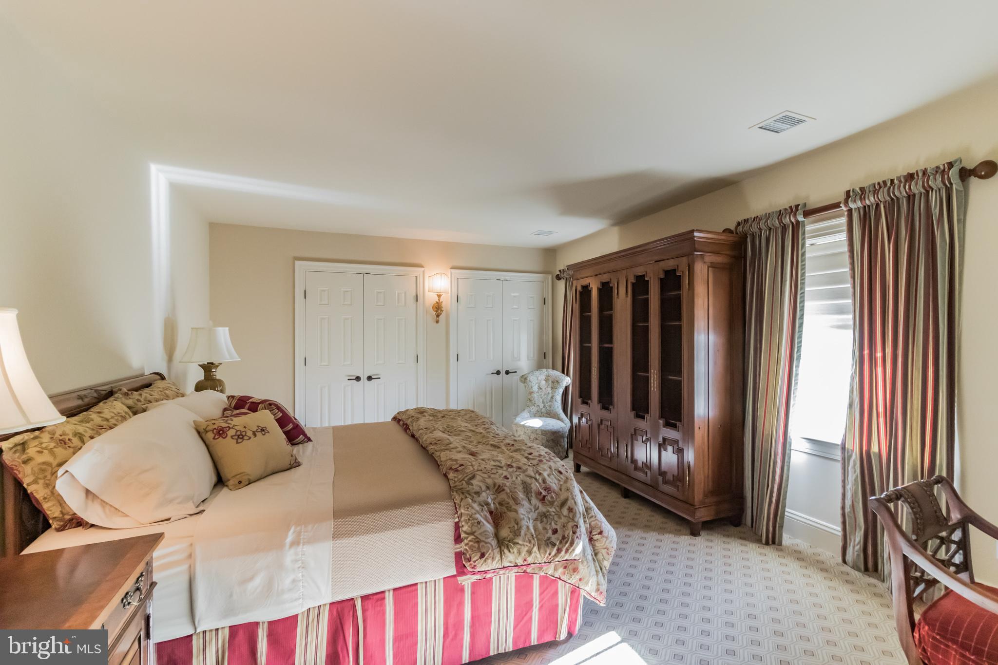 1911 Stone Ridge Lane Villanova, PA 19085 - Photo 23 of 32 a bedroom with a bed and a window